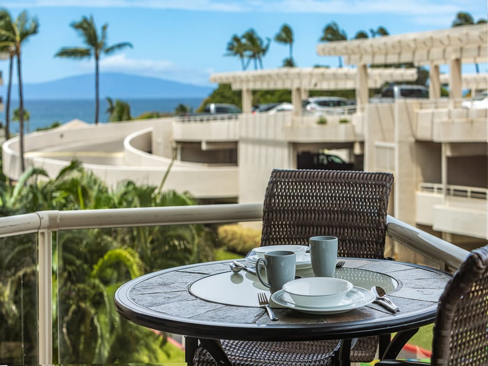 Savor your morning coffee on your private balcony with a peak-a-boo ocean view..