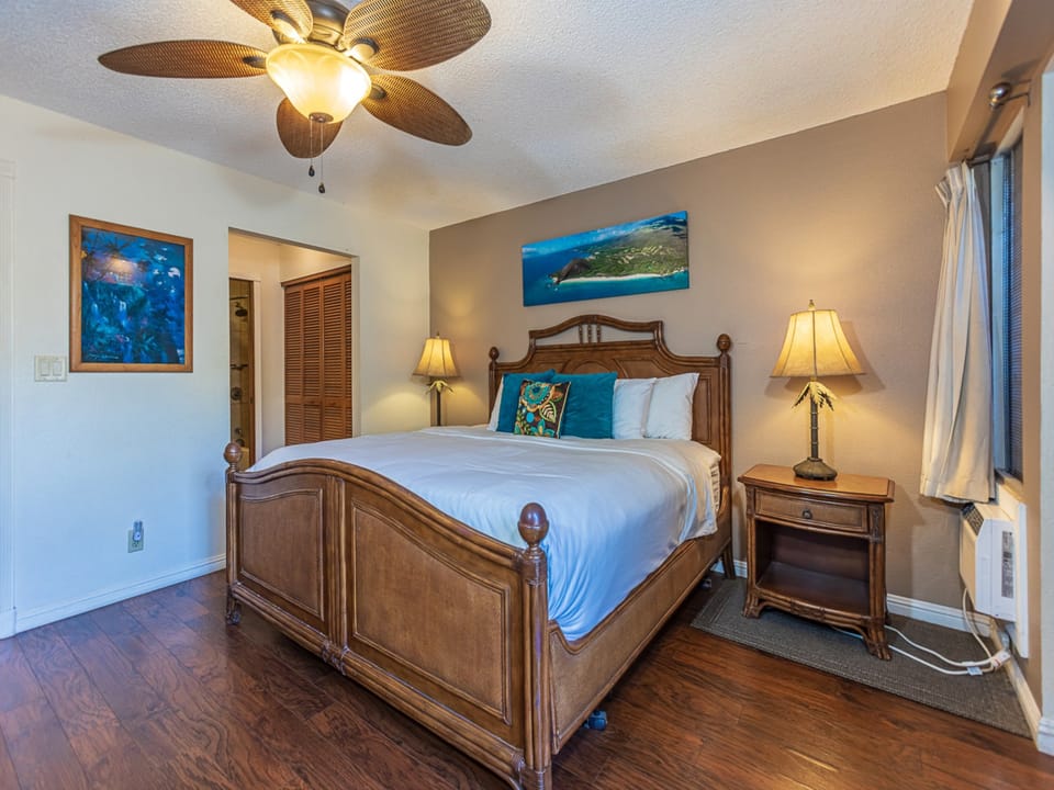 Drift off to peaceful sleep in your tropical-themed bedroom with a ceiling fan breeze.