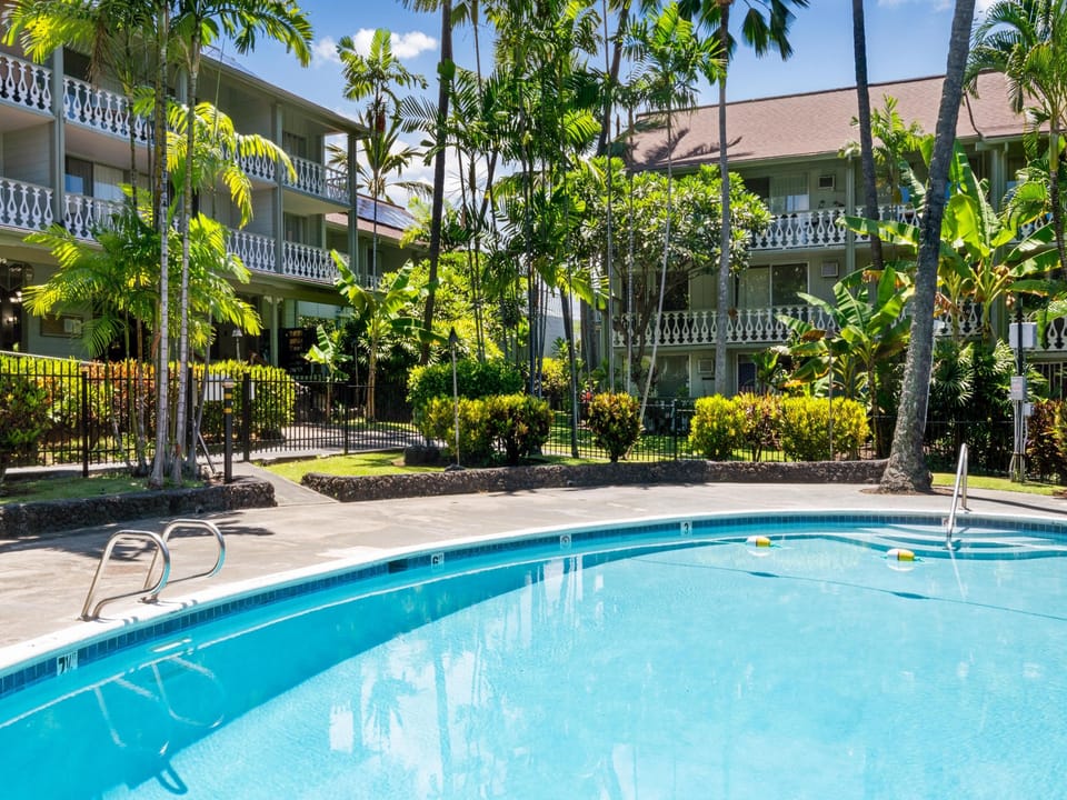 Take a refreshing dip in your private pool surrounded by swaying palms and tropical gardens.
