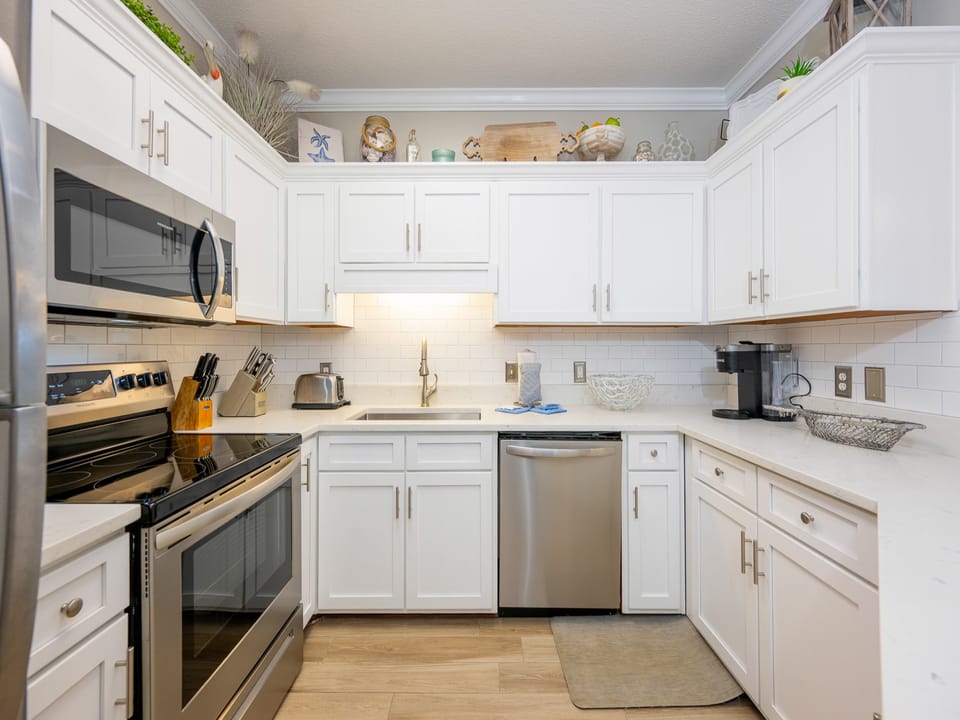Craft delicious meals while enjoying the inviting layout and warm charm of this beachside kitchen