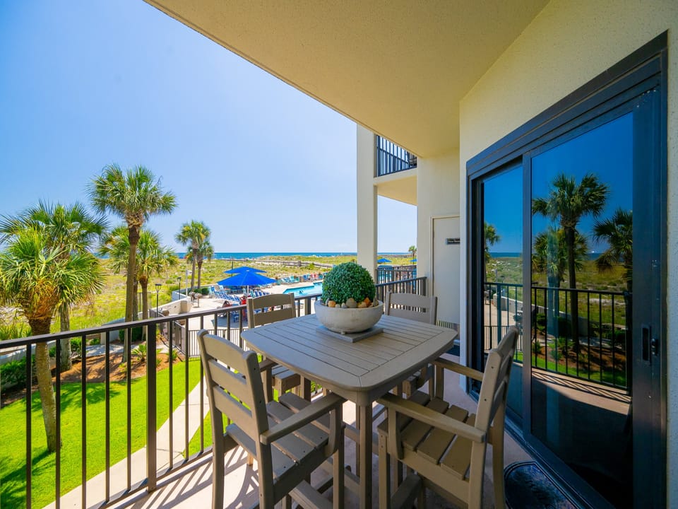Enjoy morning coffee at your balcony table while taking in the lovely coastal views and vibrant surroundings