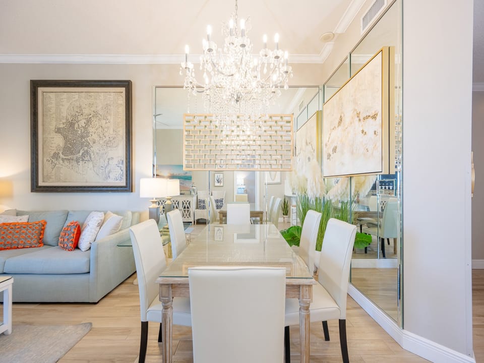 Dine with family around the elegant table while enjoying the bright vibe and stylish decor of this inviting space