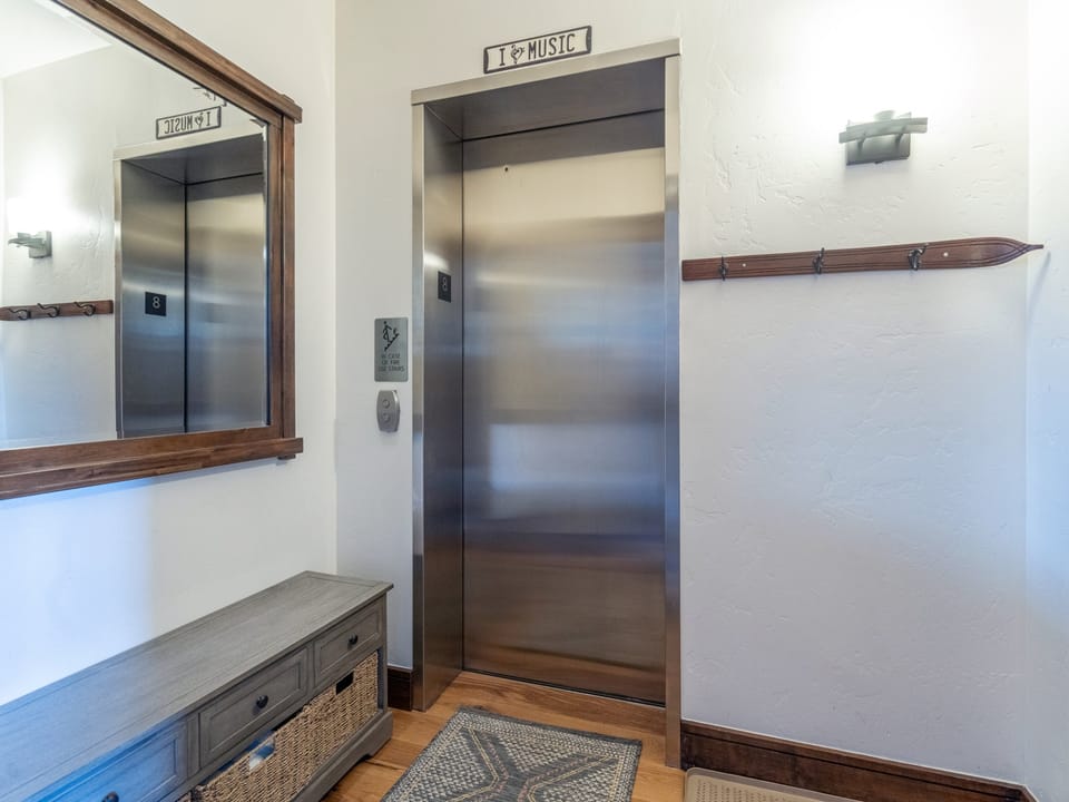 Take the convenient elevator to your floor, surrounded by charming rustic touches and thoughtful design details that welcome you home.
