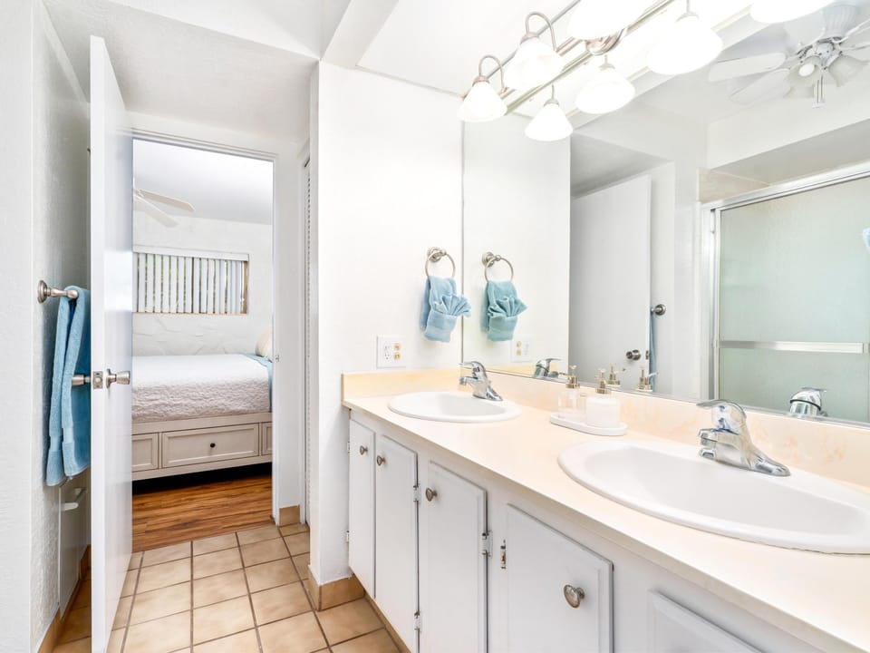 Unwind in your spacious bathroom with dual sinks, perfect for getting ready together while sharing morning conversations.