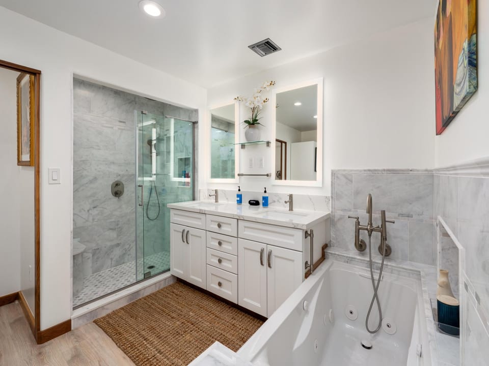Indulge in your private spa-like retreat with dual vanities, marble shower, and a soaking tub perfect for unwinding after adventures.