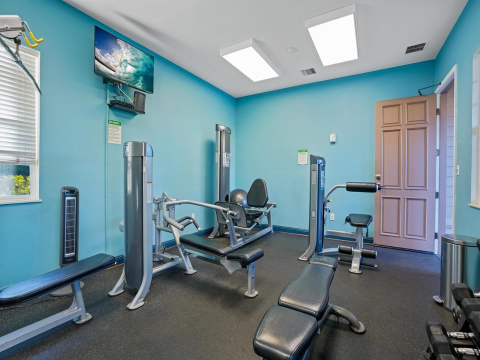 Your private fitness sanctuary awaits with modern equipment and energizing turquoise walls to keep you motivated during your stay.