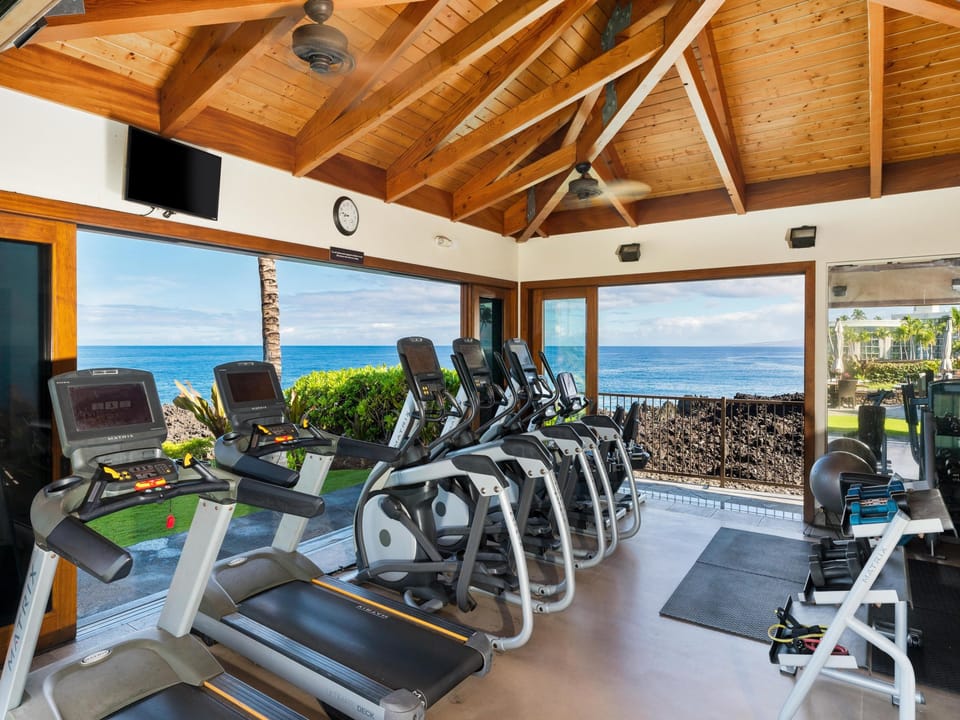 Picture yourself working out with stunning ocean views stretching endlessly before you. This fully-equipped fitness center invites you to stay active while soaking in the coastal beauty that surrounds your tropical retreat.