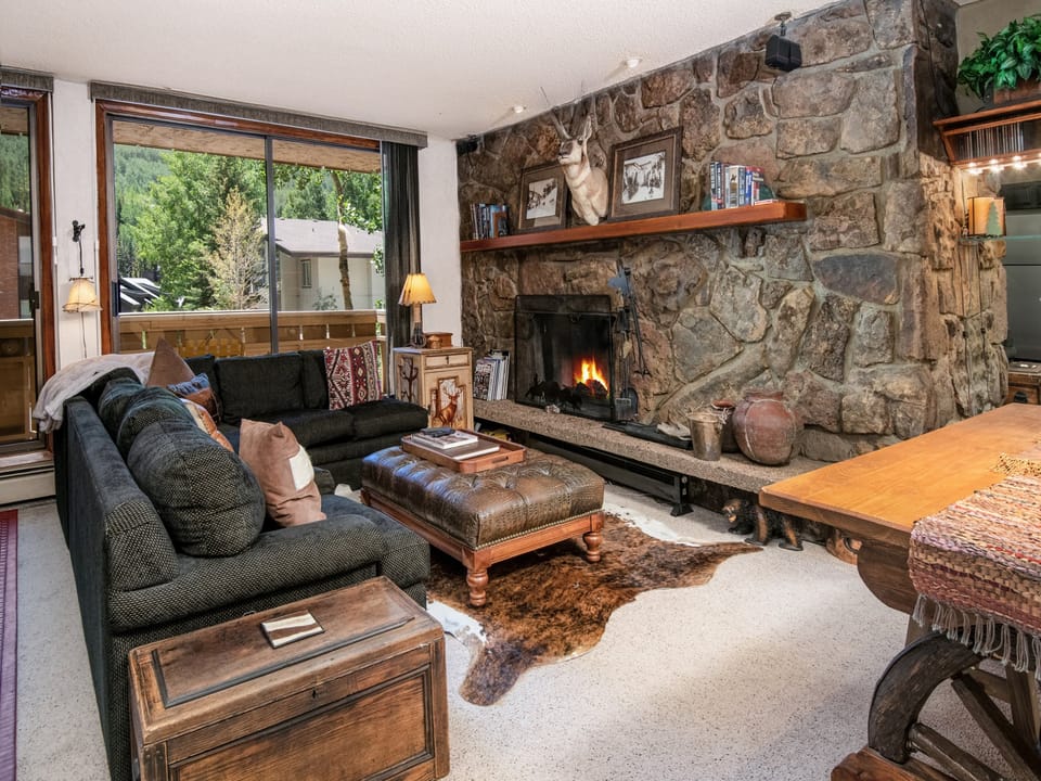 Unwind by your own crackling stone fireplace, where rustic mountain charm meets cozy comfort—perfect for après-ski evenings with alpine views framing your retreat.