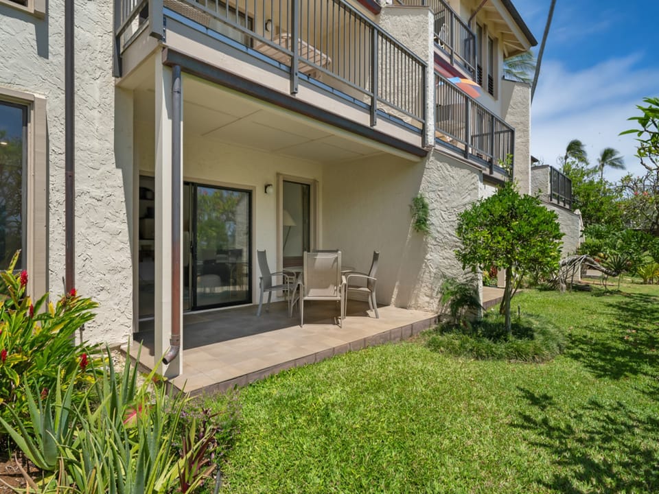 Your private patio surrounded by lush tropical gardens offers the perfect spot to unwind after a day of island adventures, with comfortable seating for morning coffee or evening relaxation.