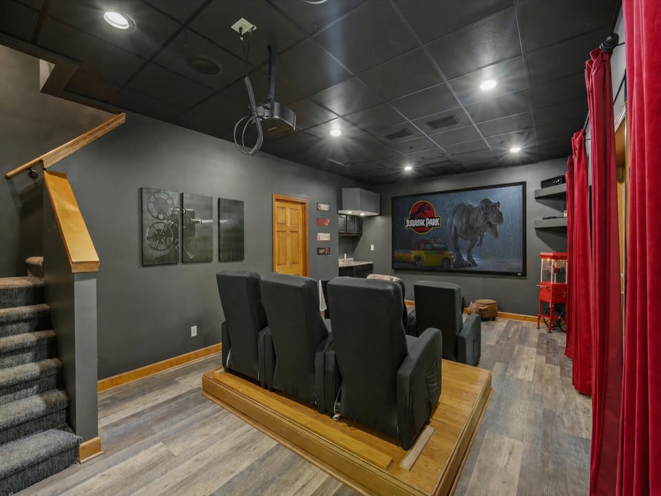 Theater seating and extra large projector screen.