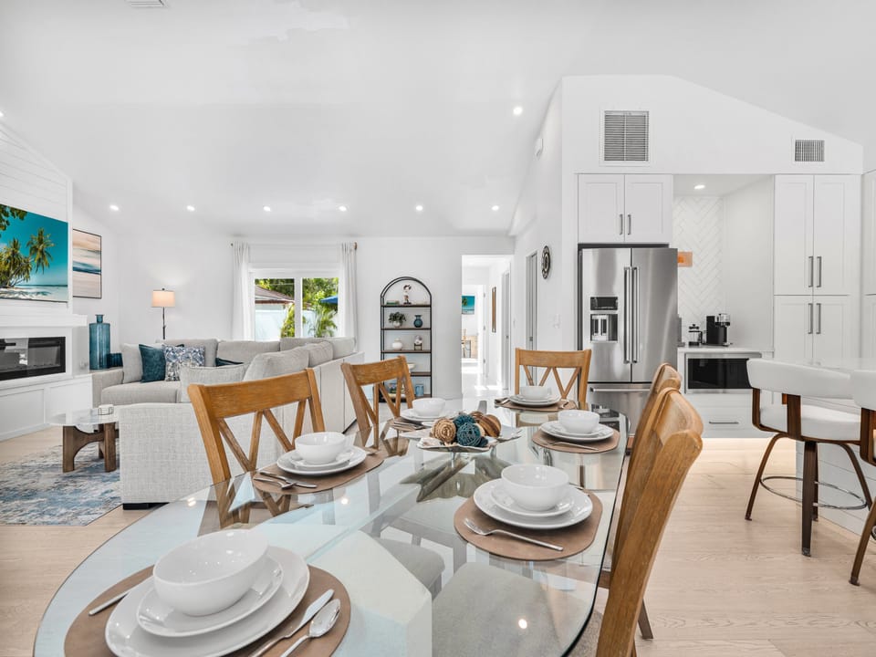 Step into an open-concept retreat where coastal elegance meets everyday comfort. Gather around the dining table, unwind in the living room, or whip up your favorite meals in the fully-equipped kitchen—all bathed in natural light.