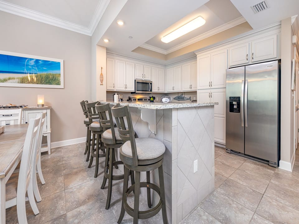 Gather around the breakfast bar in this kitchen as you share stories while meals simmer nearby