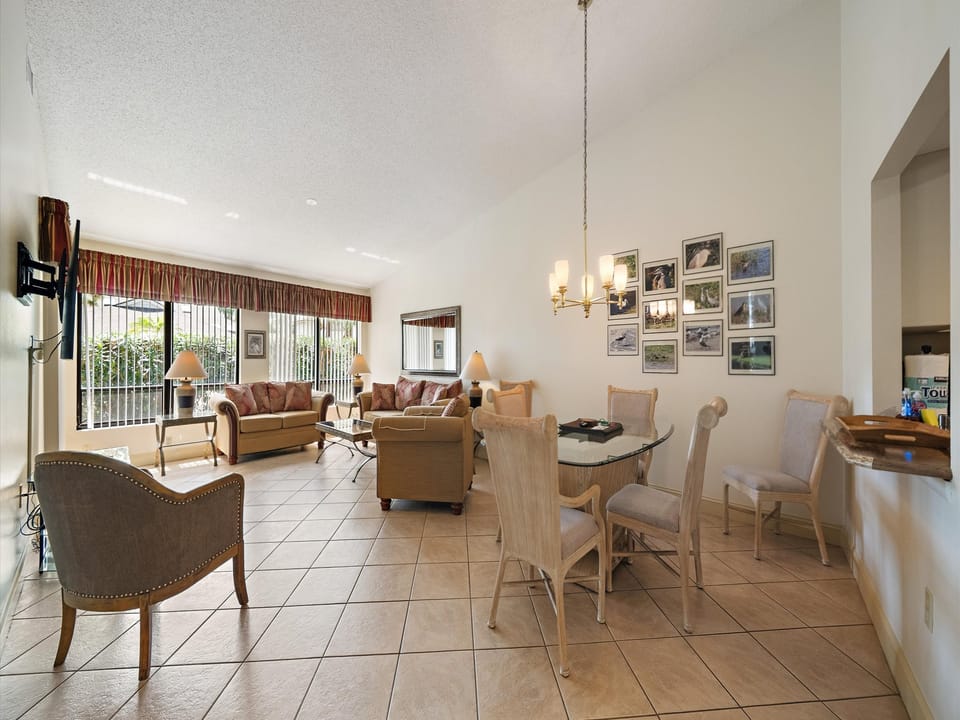 Step into this bright, open living space where comfort meets elegance. Relax on plush sofas, enjoy meals at your dining table, and unwind in a welcoming atmosphere filled with natural light and thoughtful touches.