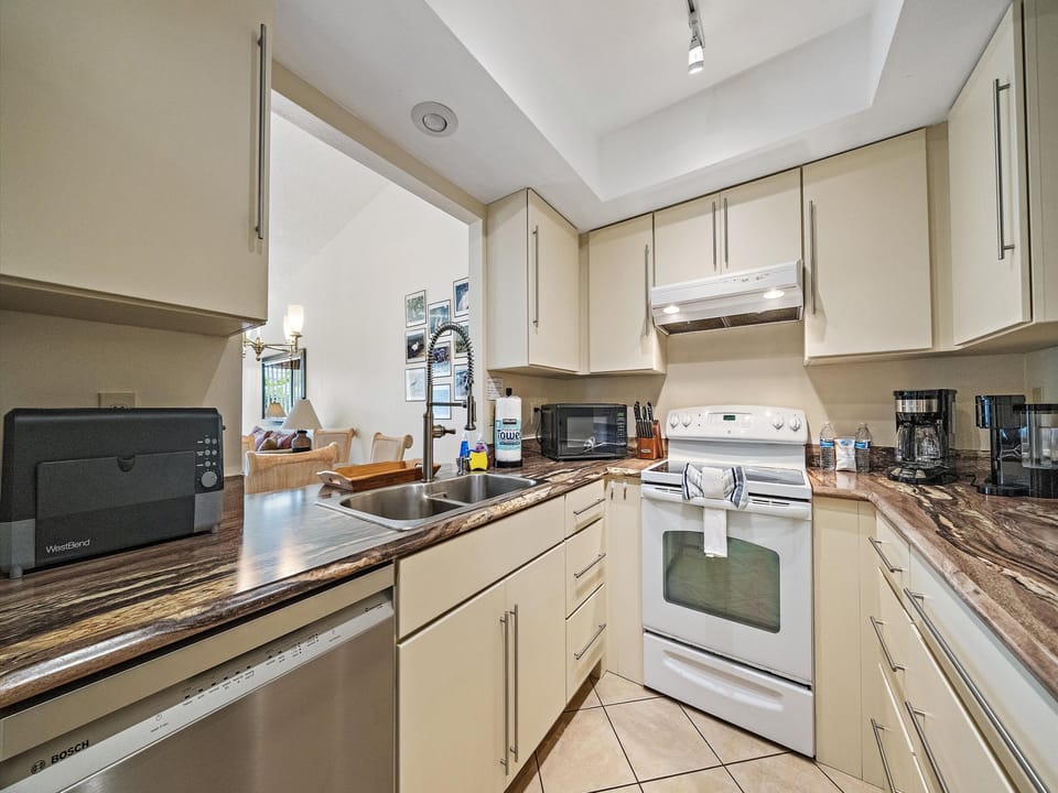 This bright, modern kitchen has everything you need to prepare delicious meals, with plenty of counter space and appliances ready for your culinary adventures during your stay.