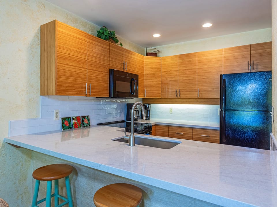 Your modern kitchen features sleek counters, warm cabinetry, and all the appliances you need to prepare meals during your stay.