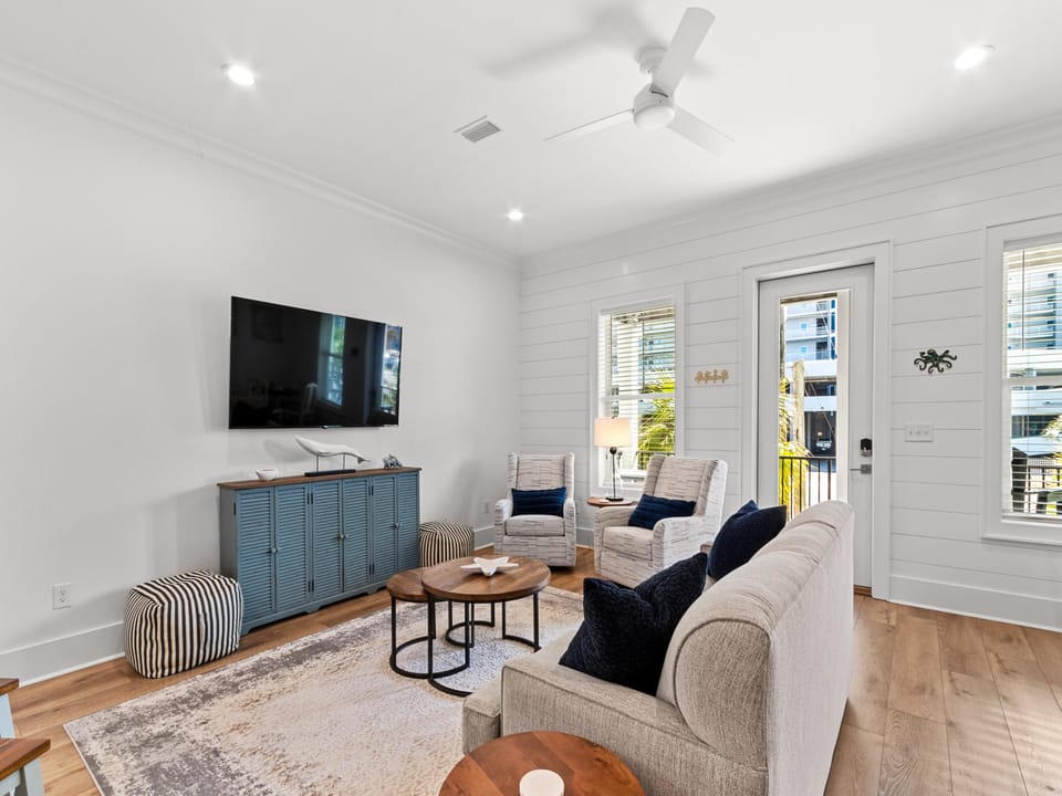 Soft armchairs invite you to sink in and relax while watching your favorite show in the living room