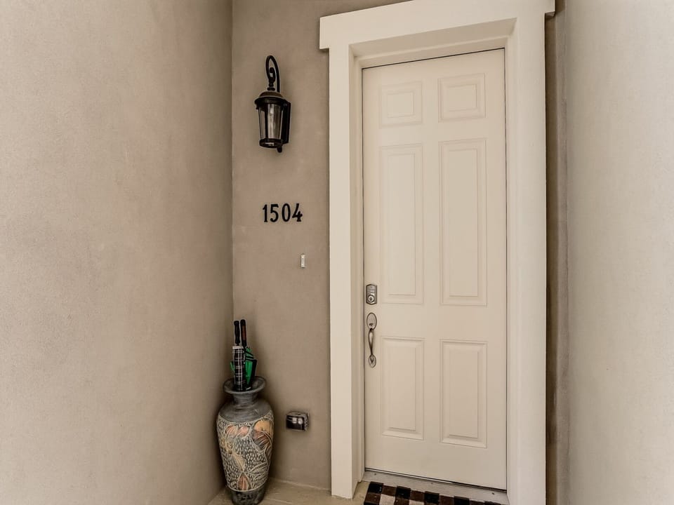 Your private entrance awaits at unit 1504, complete with elegant lighting and thoughtful touches that make arriving feel like coming home.