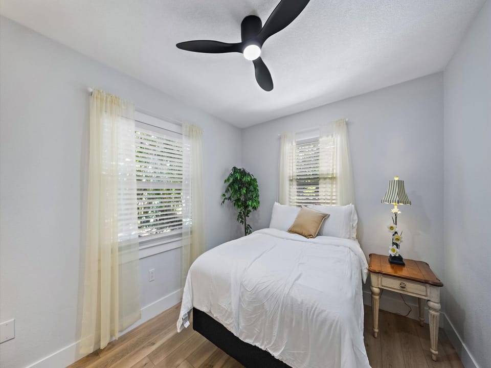 Settle into your peaceful retreat with soft linens, natural light, and a gentle ceiling fan to keep you cool and comfortable.
