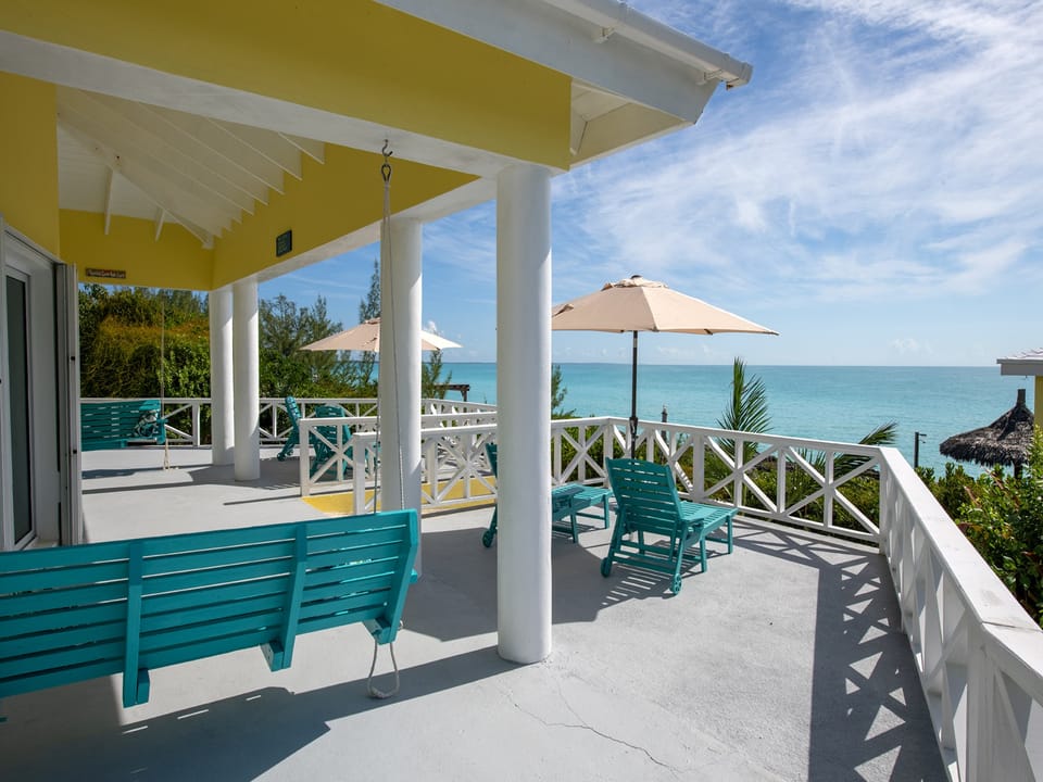 The patio is furnished with 2 three-person porch swings.