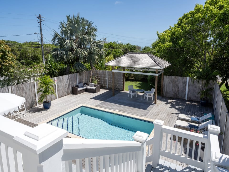 The pool area is surrounded by lush landscaping and shaded seating.  Our pool can be heated for a charge of $50 per day.