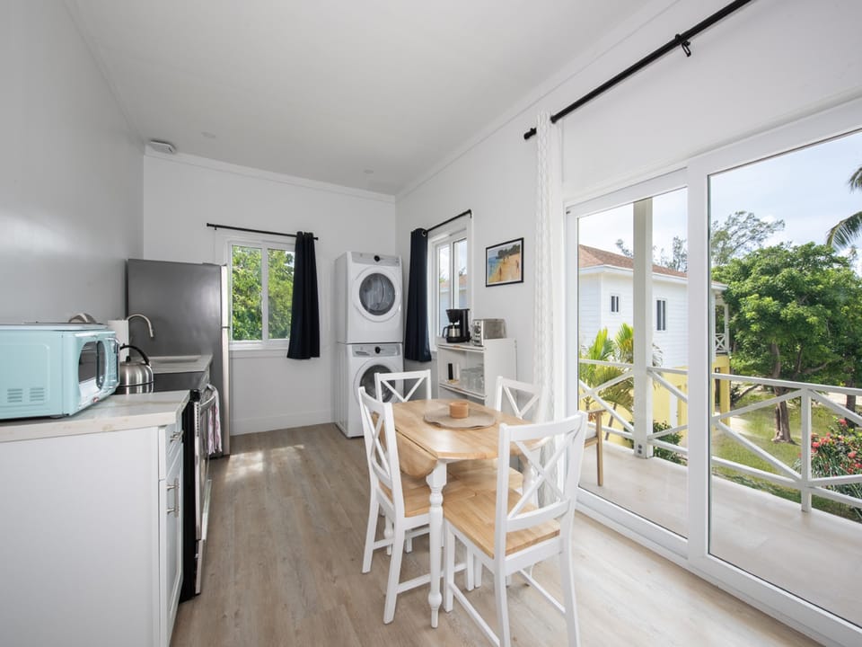 Two bedroom suite:  Fully equipped kitchen and dining area with view of grounds.