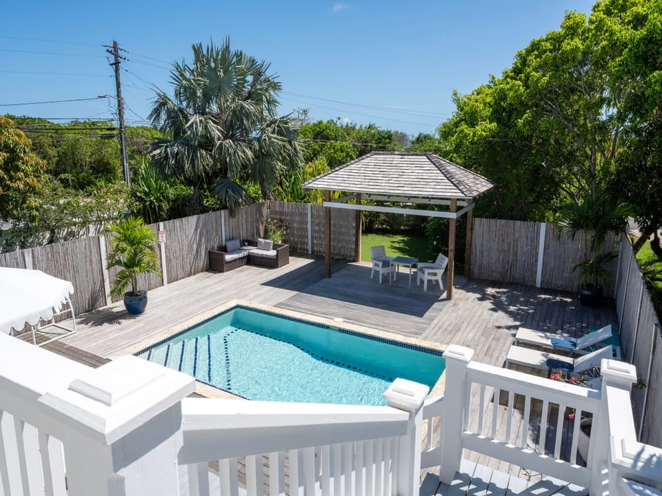 The pool area is surrounded by lush landscaping and shaded seating.  Our pool can be heated for a charge of $50 per day.