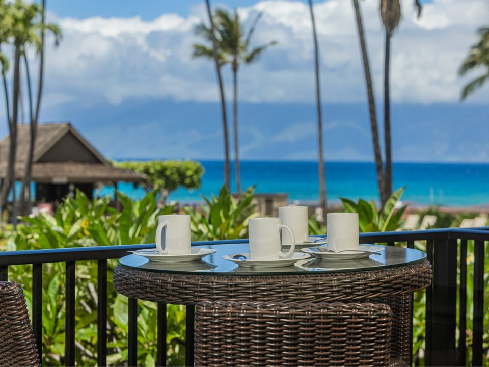 Sip your morning coffee on the balcony with breathtaking ocean views and swaying palms.