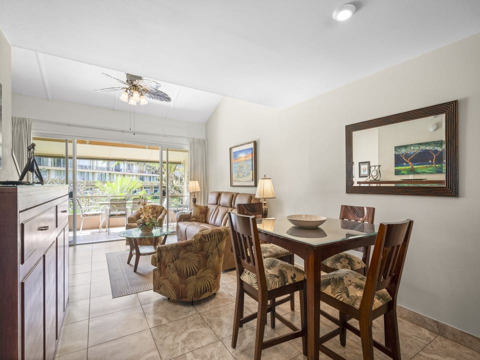 Unwind in your spacious living and dining area, where breezy island-style furnishings and large windows invite natural light. Step through sliding doors to your private balcony for tropical views.