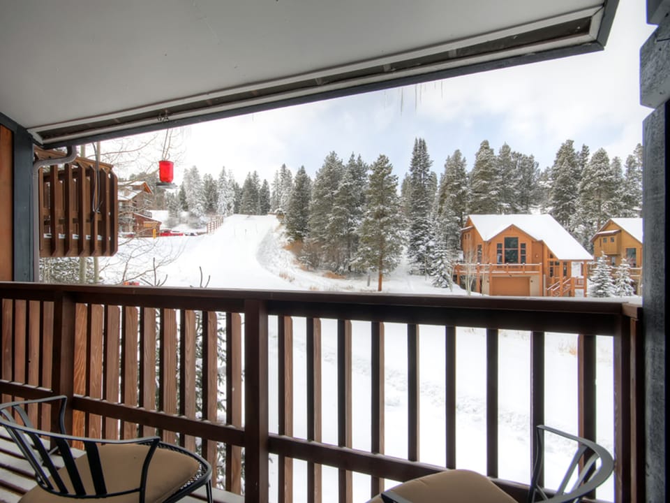 Watch skiers on the slopes from the private deck - 4 O'Clock Lodge D26 Breckenridge Vacation Rental