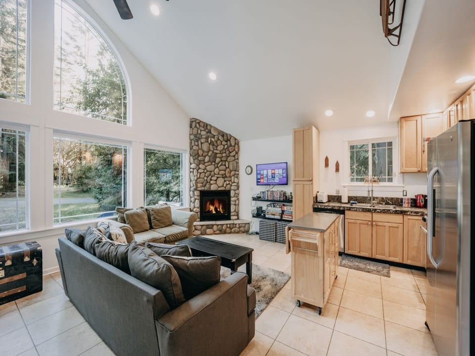 Living room with gas fireplace and a sofa bed