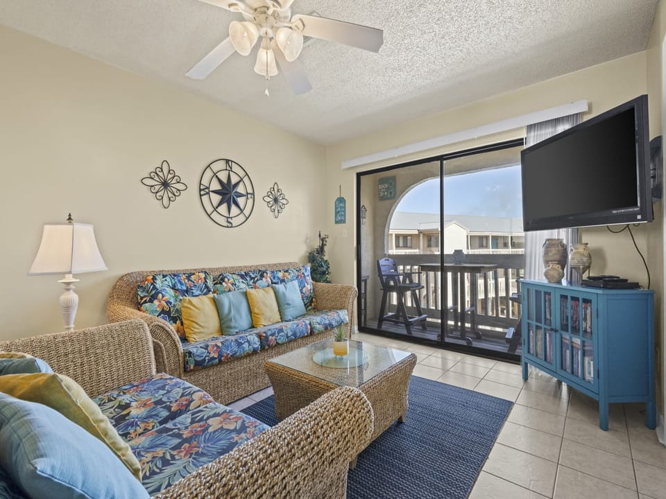 Welcome to your next vacation destination. Spend your down time relaxing in the cozy living area which features a large, mounted television and balcony overlooking the pools.