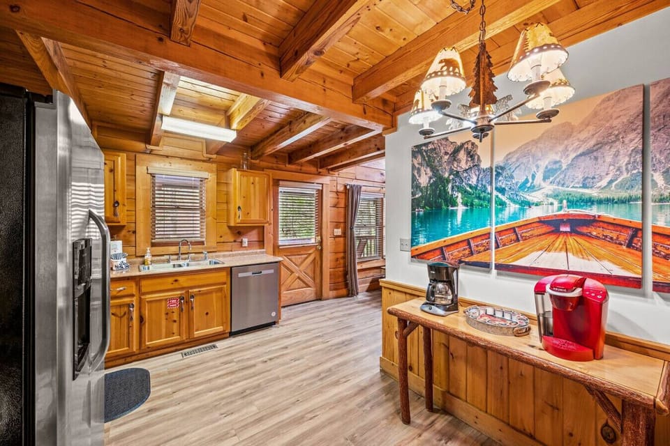 Fully equipped kitchen with stainless steel appliances and a dedicated coffee bar.