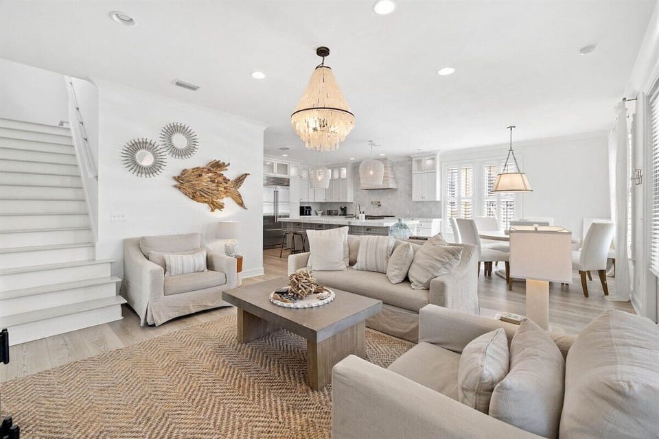 An airy, open-concept space with upscale coastal décor and natural light.