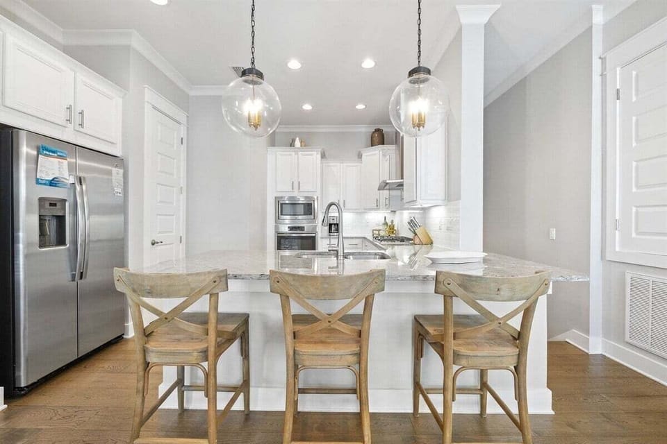 Modern kitchen is fully stocked and ready to whip up any meal.