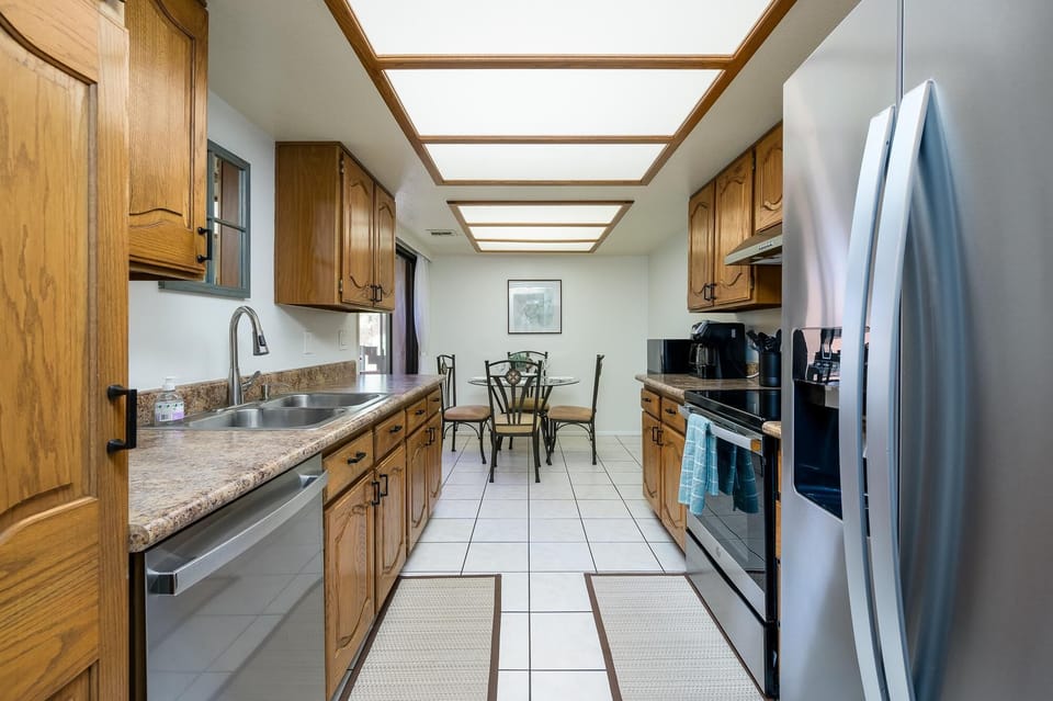 Fully stocked kitchen with stainless steel appliances
