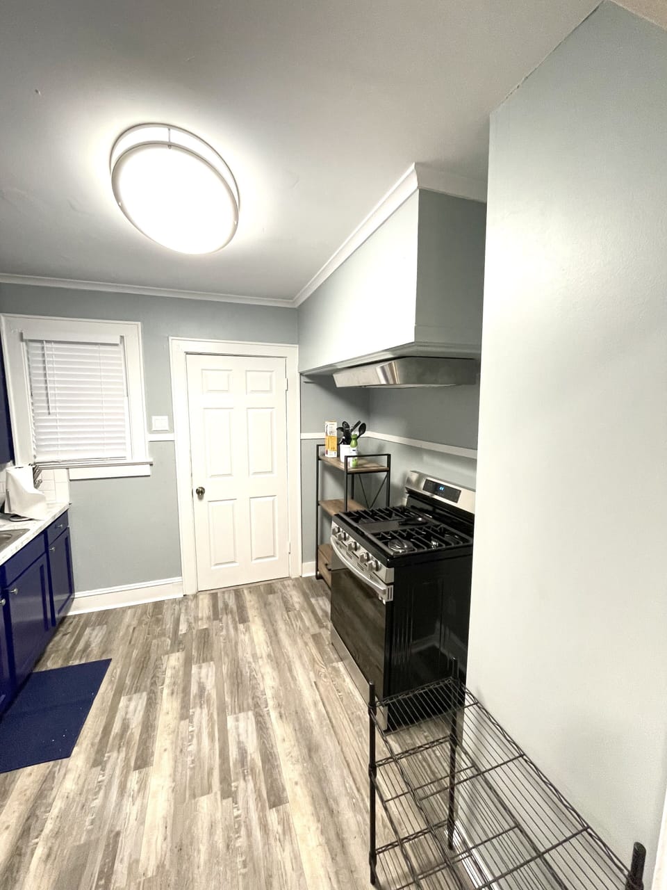 Kitchen with dishes and cooking utensils included.