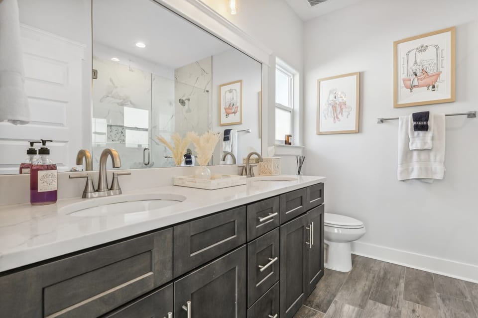 Primary Bathroom with a Double Vanity and a Walk-in Shower