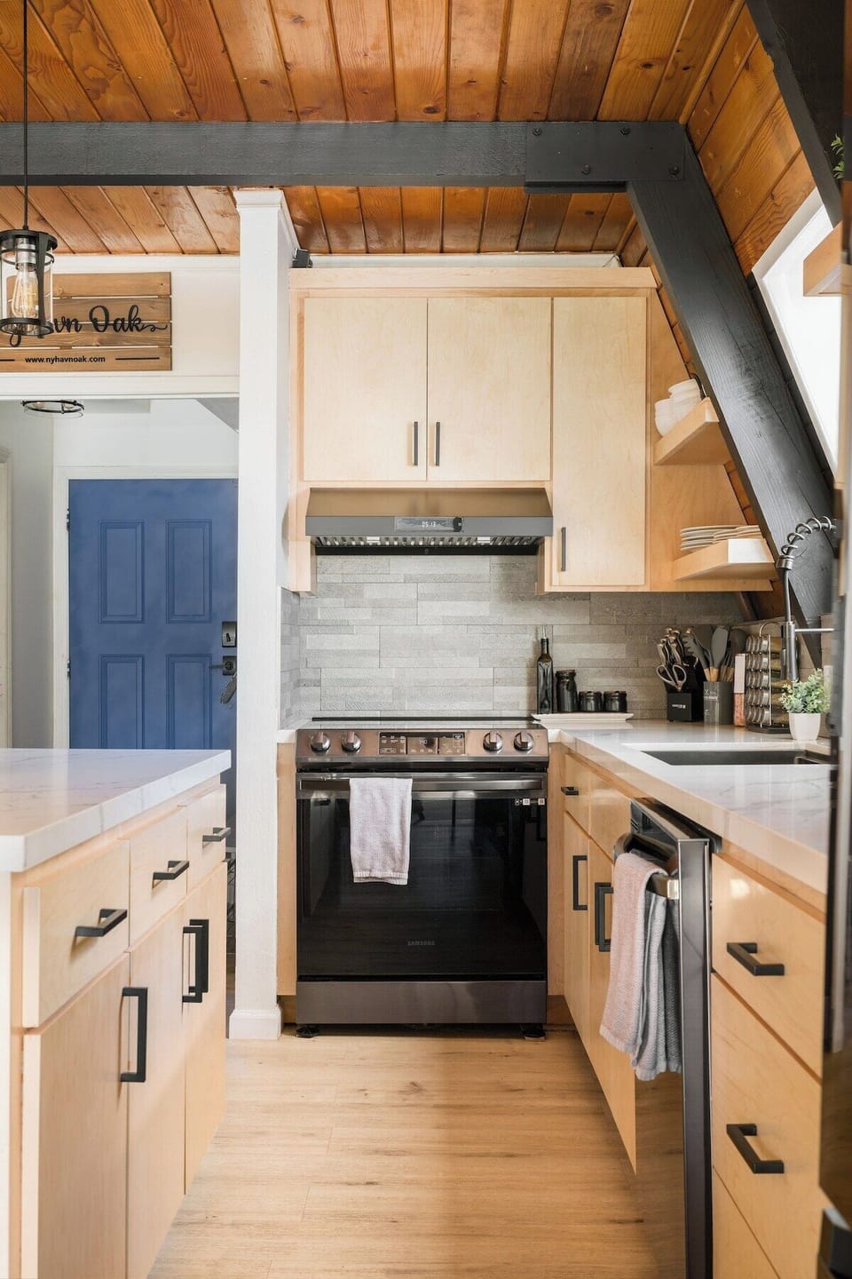 Completely remodeld kitchen with maple cabinets, brand new Samsung Oven/top, dishwasher, large commercial sink and island