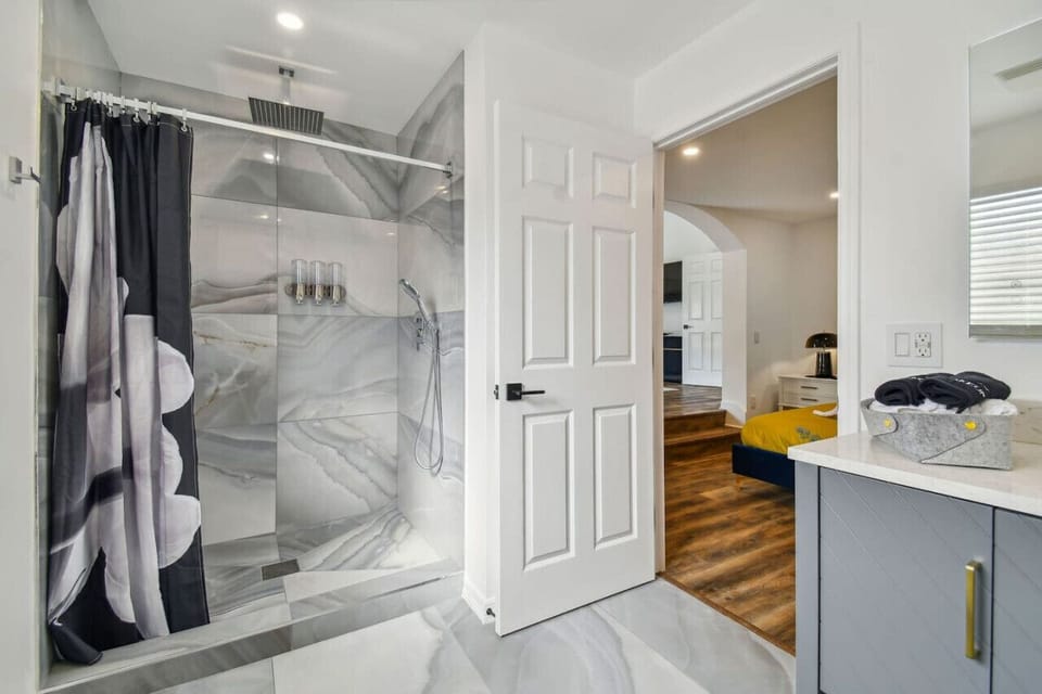 Master suite ensuite bathroom with rainshower and Morrocan shower and hair products