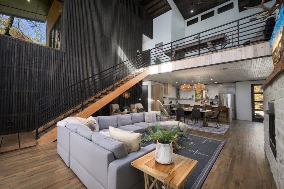 Open-concept living at its finest—soaring ceilings, modern architecture, and a seamless flow from lounge to kitchen