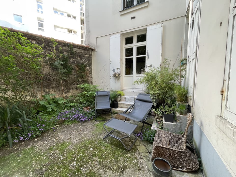The lovely courtyard with relaxing chairs welcomes you outside for coffee
