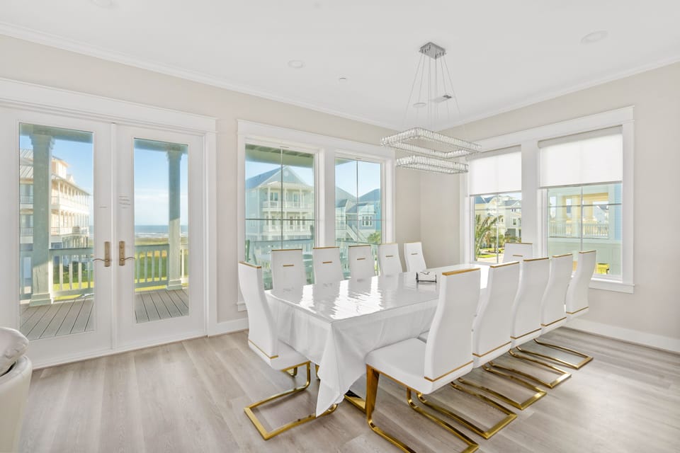 Dining room has table with 12 seats