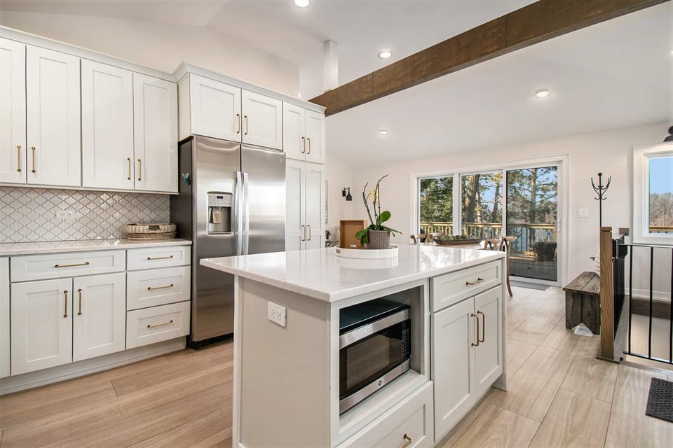 The gourmet kitchen opens to main floor eating/living area with gorgeous views.