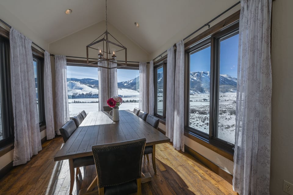 Dine in splendor with an 8 person table, enveloped by nature's canvas