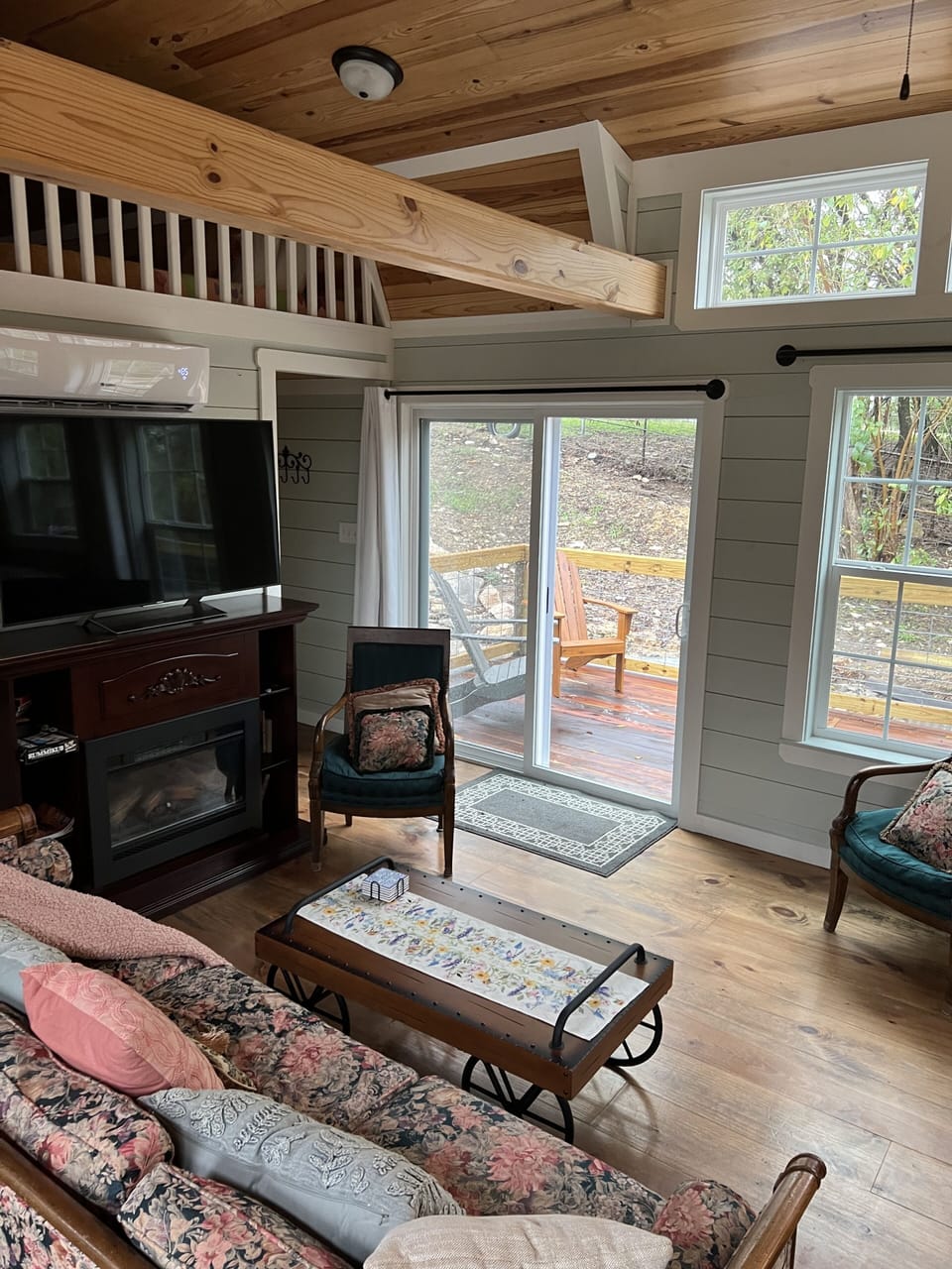 Living room with view of backyard deck
