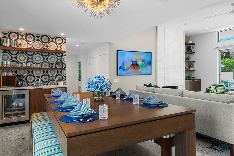 Dine in elegance in the spacious dining room, adorned with a beautifully crafted table that comfortably seats eight. The space creates a warm and inviting atmosphere perfect for family meals or elegant dinner parties.