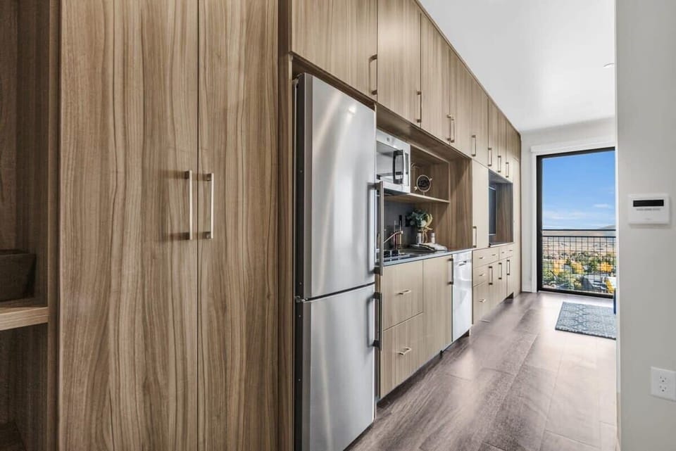 The fully stocked kitchen has stainless steel appliances, Nespresso, a toaster oven, and basic cookware so you can easily prepare delicious meals.