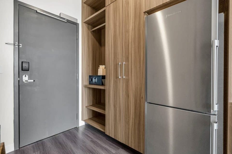 In the entryway of the home, you will find a large built-in storage closet with additional shelving to store all your personal belongings.