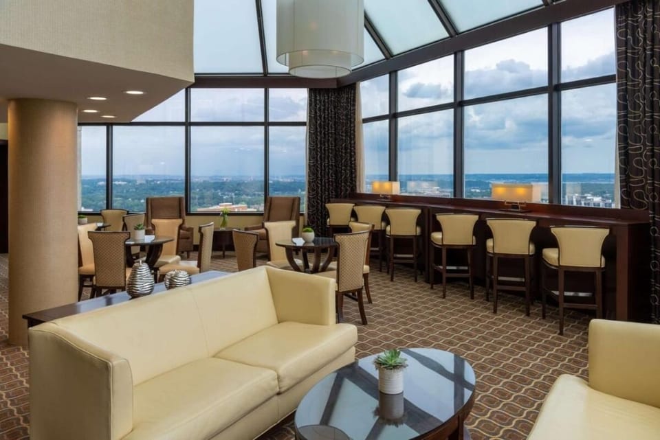 Sip and socialize in a stylish lounge with skyline views.