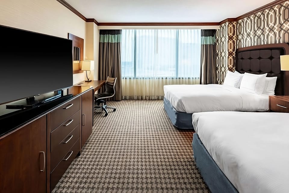 Stretch out with two beds, big TV, and roomy comfort.